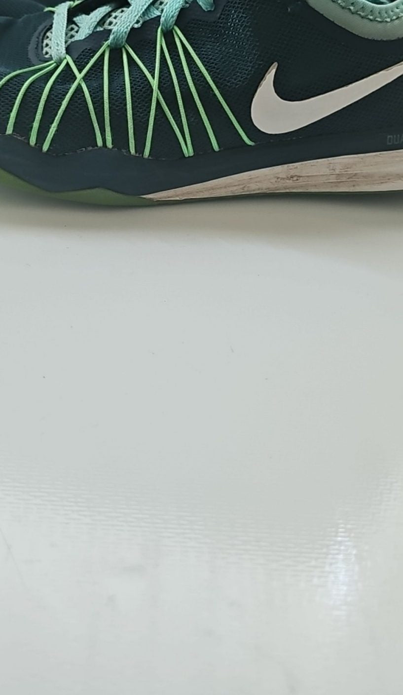 Nike black and green training shoes with mesh upper and dual fusion midsoles.