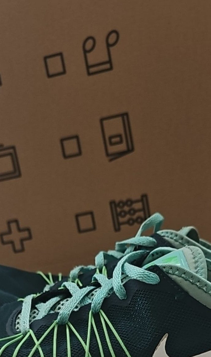 Nike black and green training shoes with mesh upper and dual fusion midsoles.