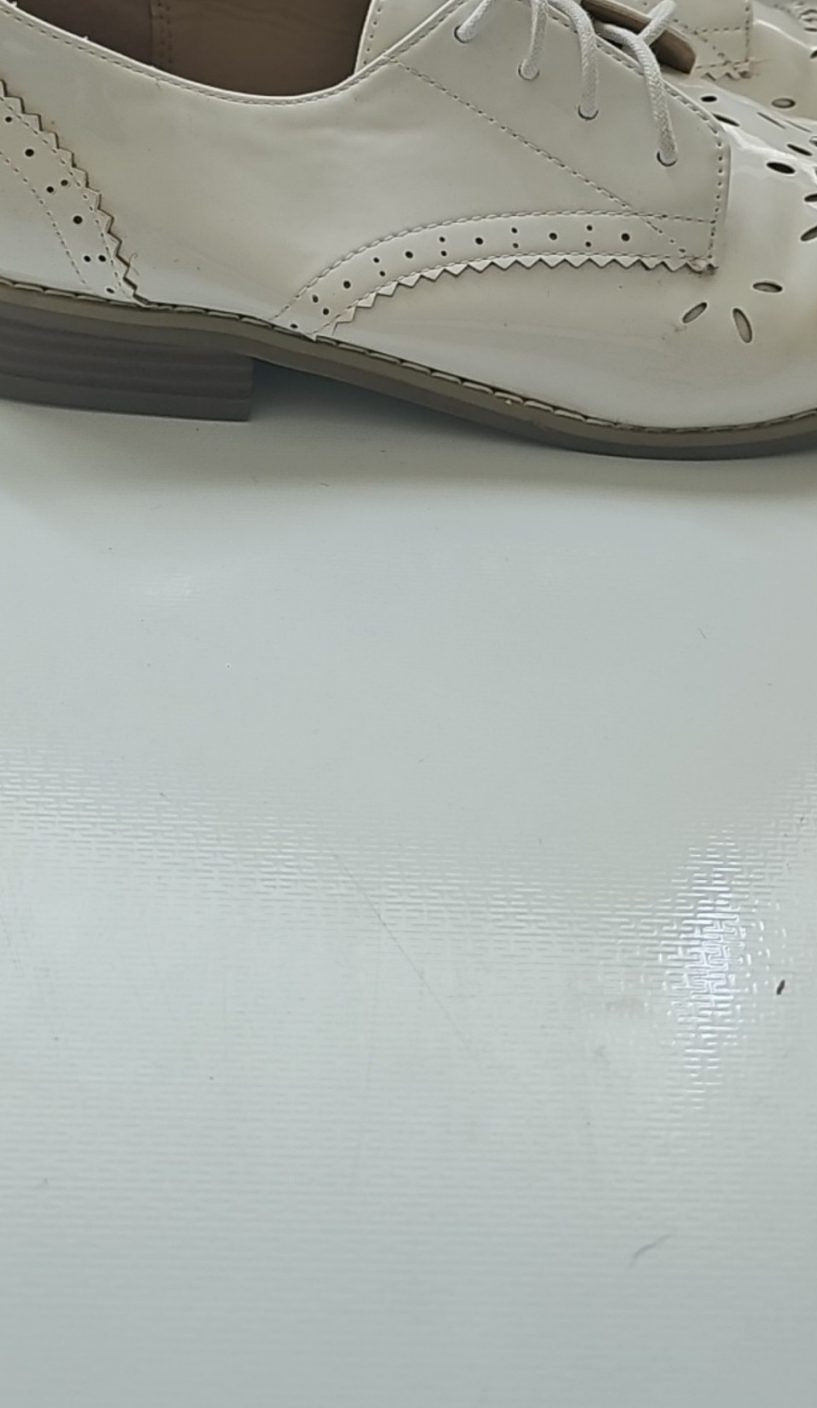 River Island cream brogues UK 4 with cut-out design and metal stud detailing.