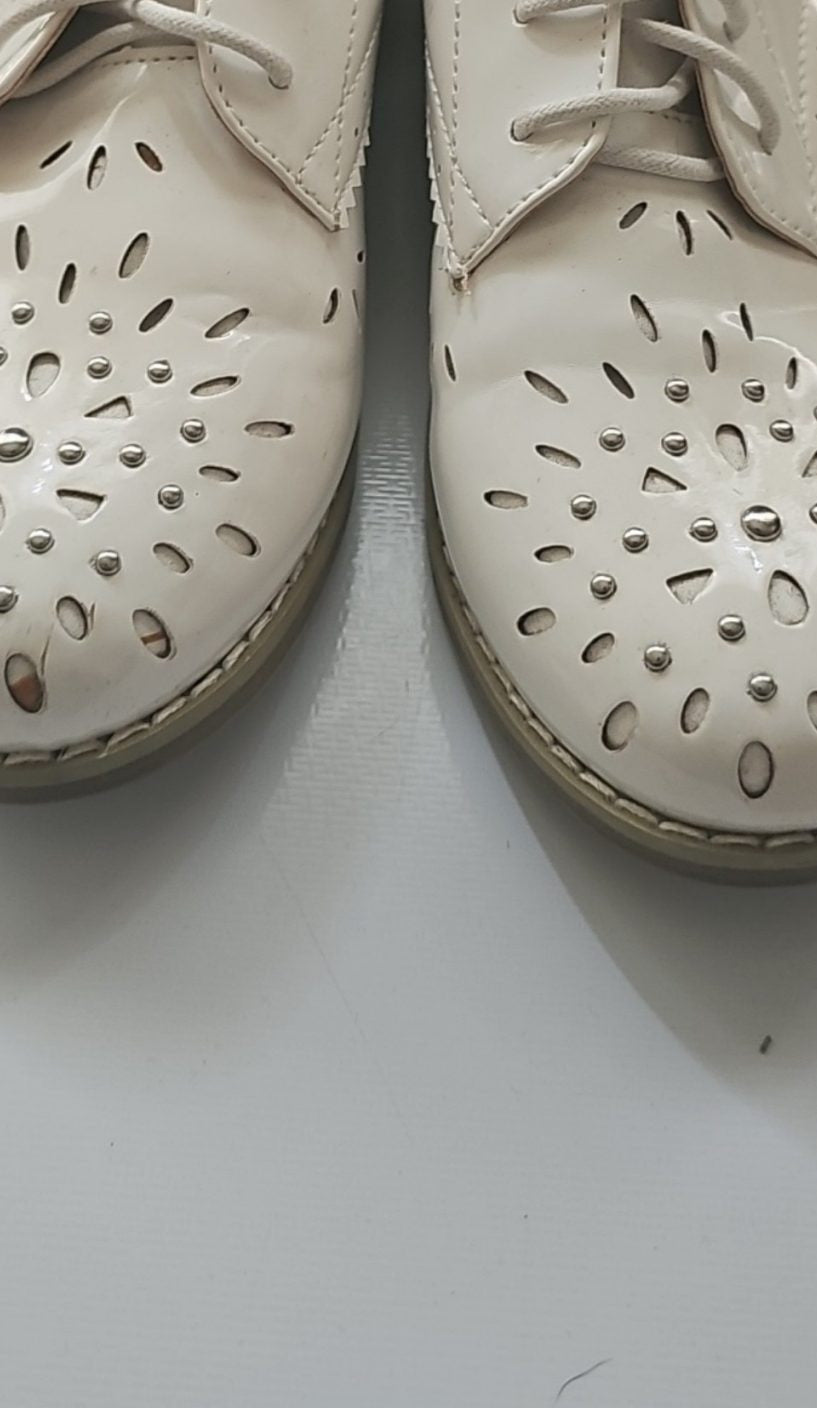 River Island cream brogues UK 4 with cut-out design and metal stud detailing.
