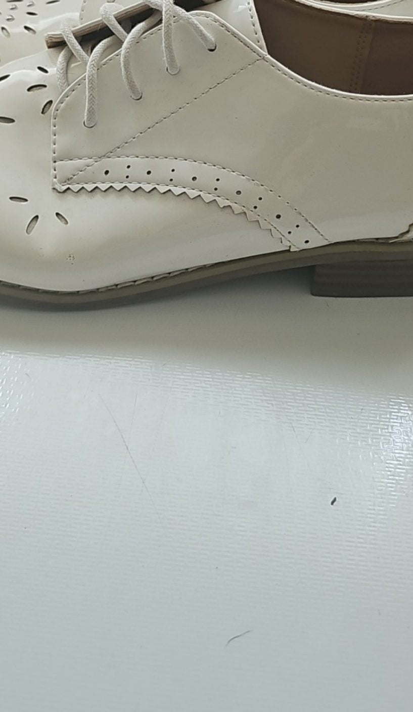 River Island cream brogues UK 4 with cut-out design and metal stud detailing.