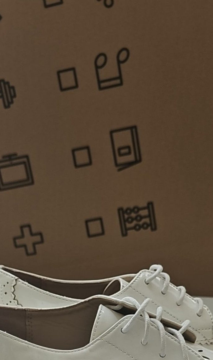 River Island cream brogues UK 4 with cut-out design and metal stud detailing.
