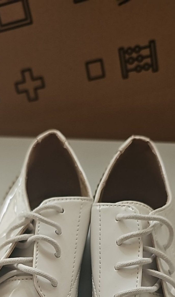 River Island cream brogues UK 4 with cut-out design and metal stud detailing.