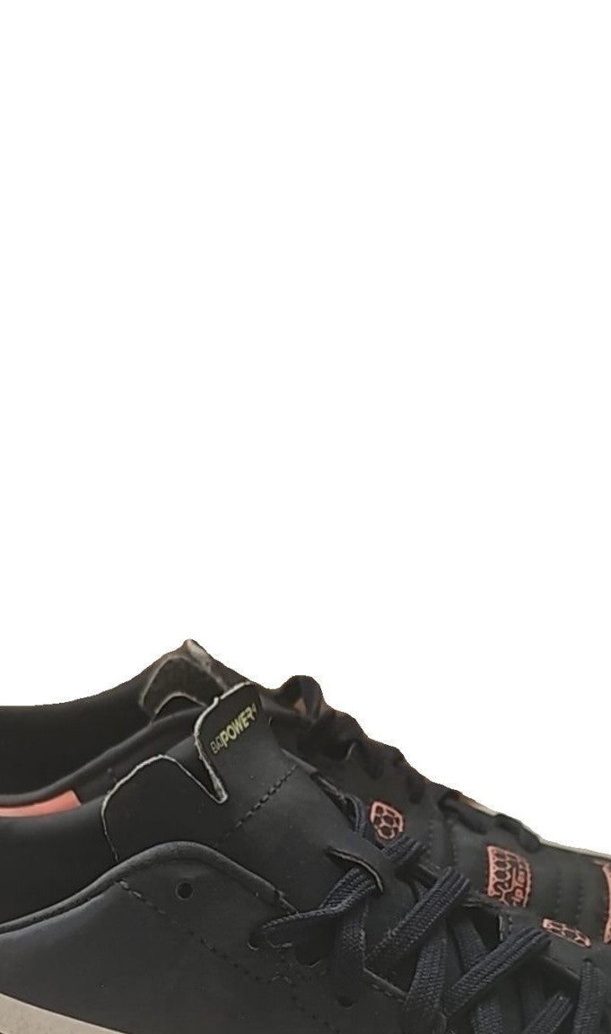 Puma black and red football boots with white formstripe, showing scuffing and wear.