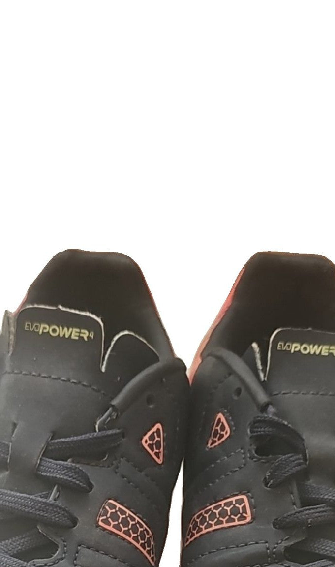 Puma black and red football boots with white formstripe, showing scuffing and wear.