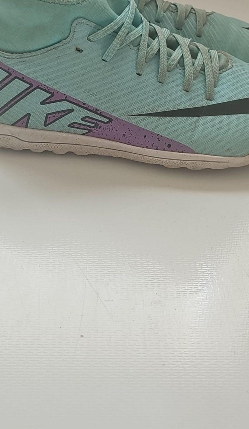 Nike green and purple Mercurial indoor football shoes with patterned rubber sole and synthetic upper.