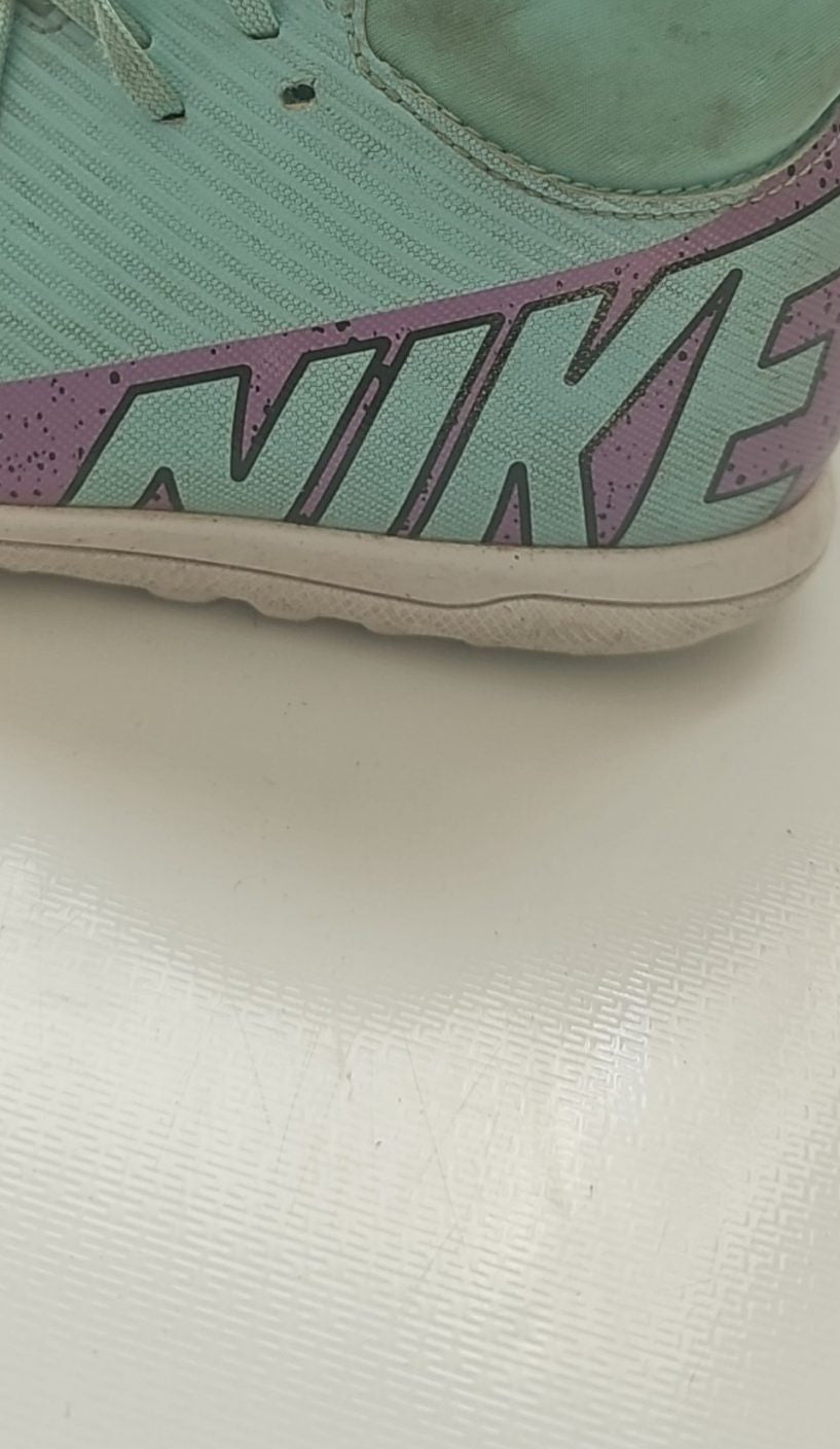 Nike green and purple Mercurial indoor football shoes with patterned rubber sole and synthetic upper.