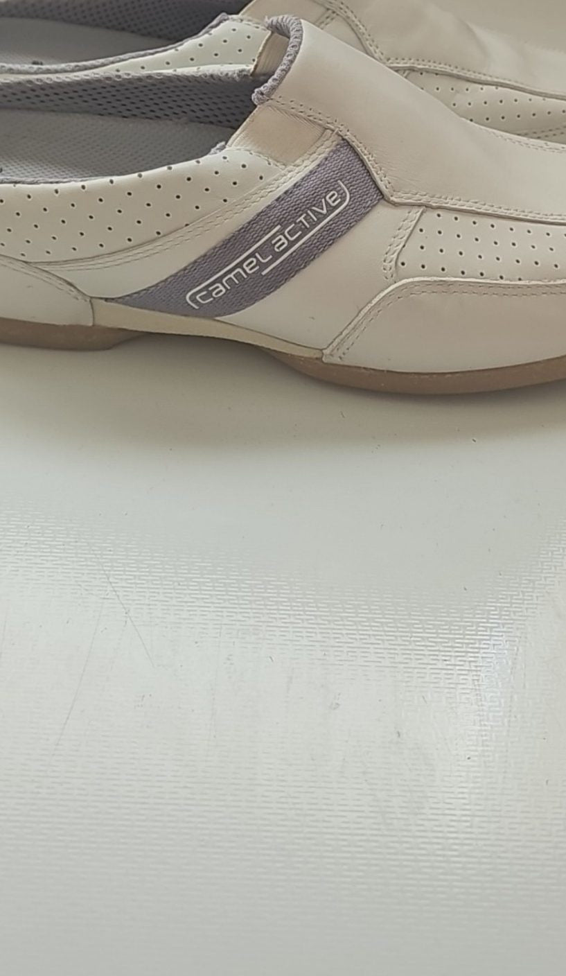 Camel Active grey and white slip-on shoes with perforated leather and logo details.