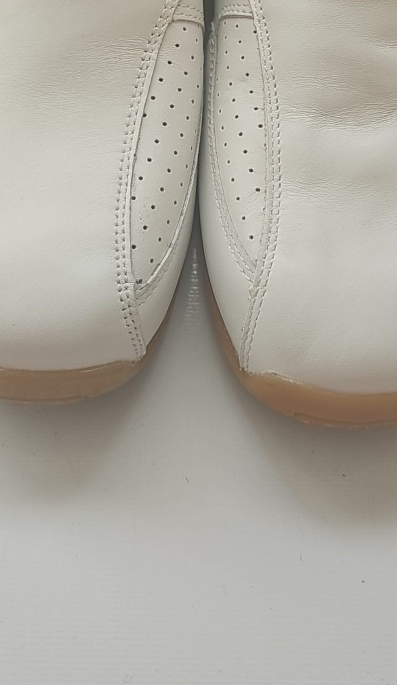 Camel Active grey and white slip-on shoes with perforated leather and logo details.
