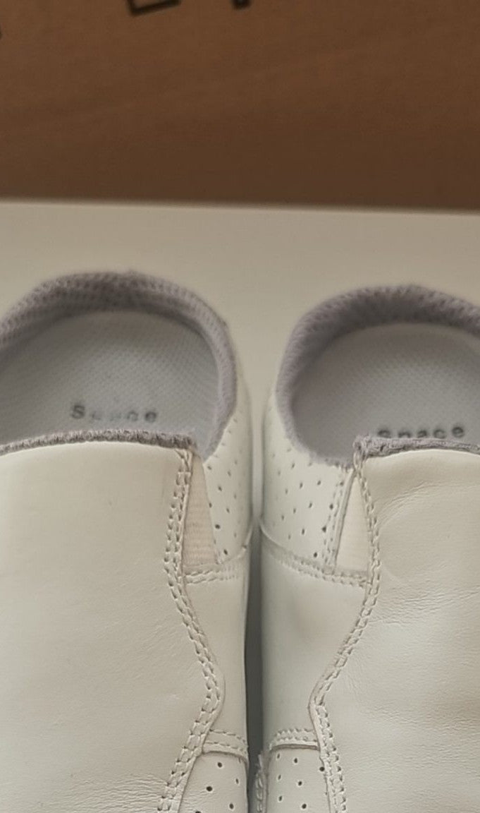 Camel Active grey and white slip-on shoes with perforated leather and logo details.