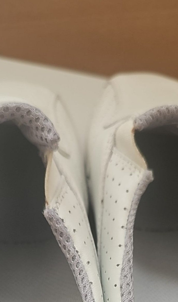 Camel Active grey and white slip-on shoes with perforated leather and logo details.