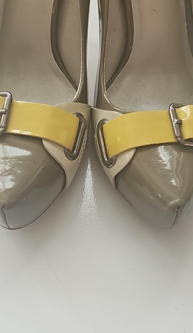 ALDO beige and taupe patent leather high heel shoes with yellow buckle detail.