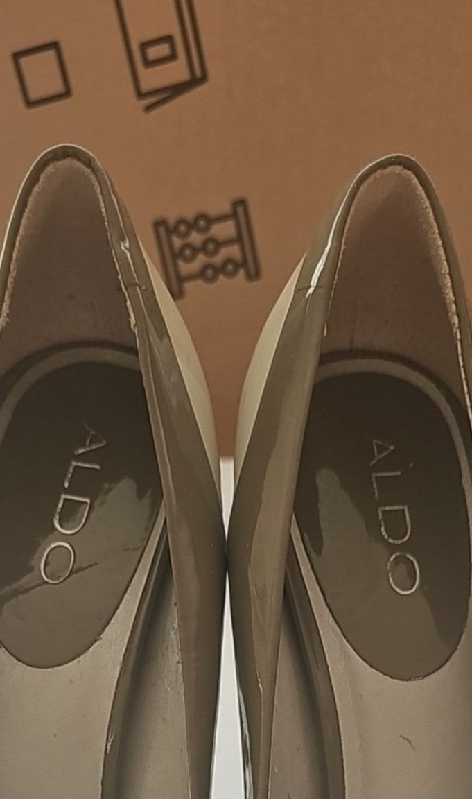 ALDO beige and taupe patent leather high heel shoes with yellow buckle detail.
