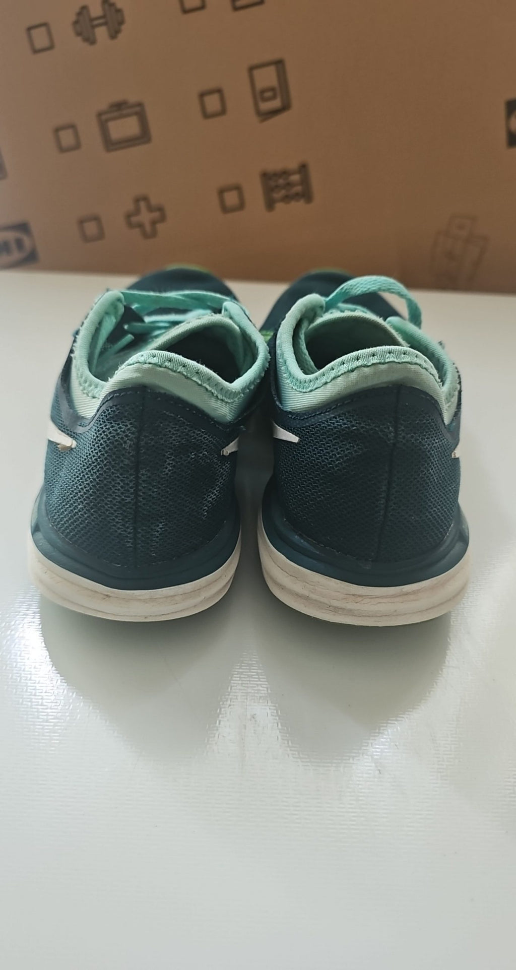 Nike black and green training shoes with mesh upper and dual fusion midsoles.