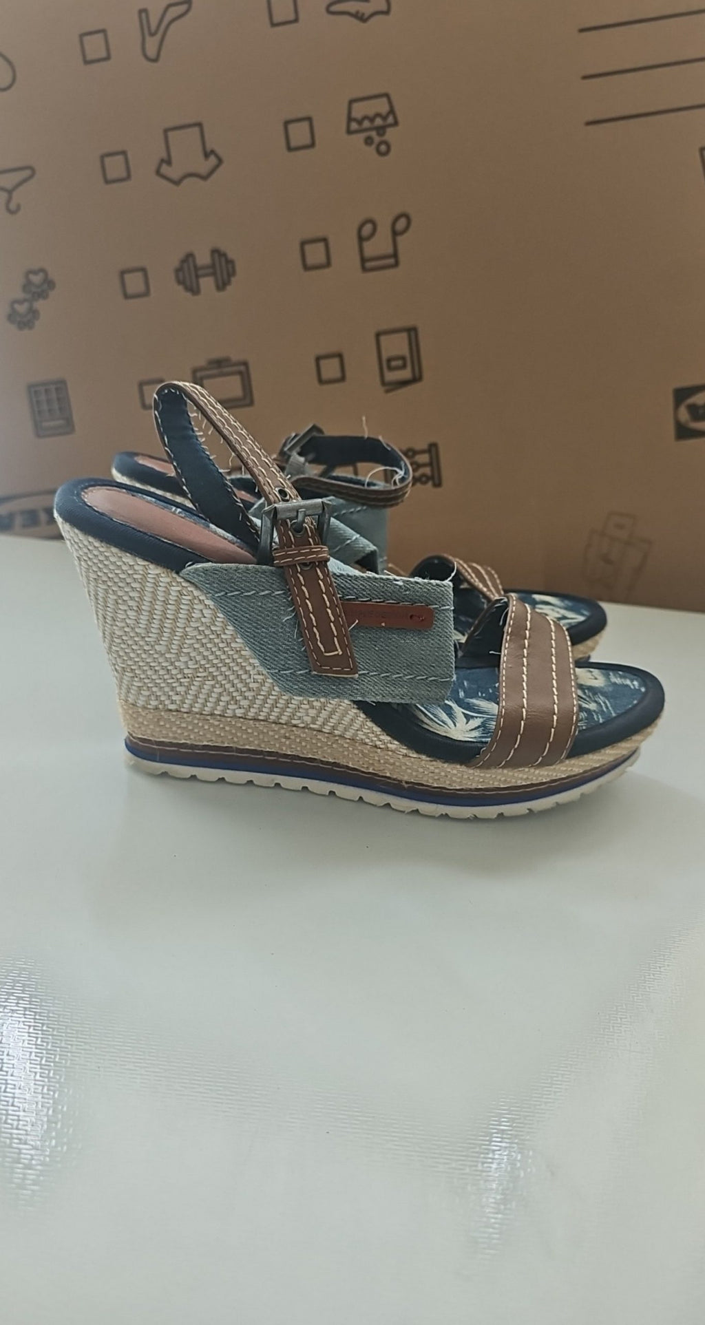 Escape beige and brown wedge sandals with green fabric strap and tropical print inner sole.