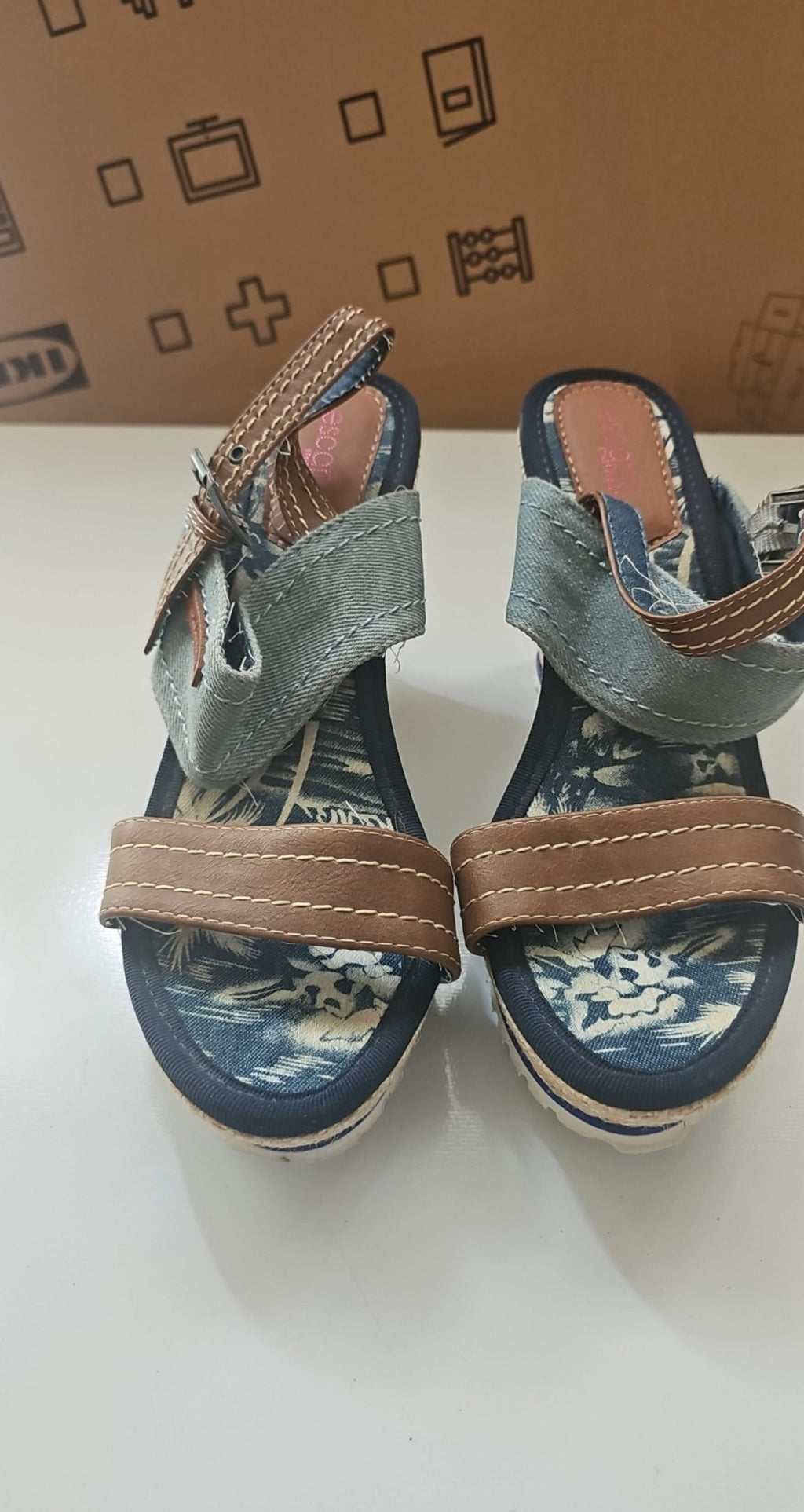 Escape beige and brown wedge sandals with green fabric strap and tropical print inner sole.