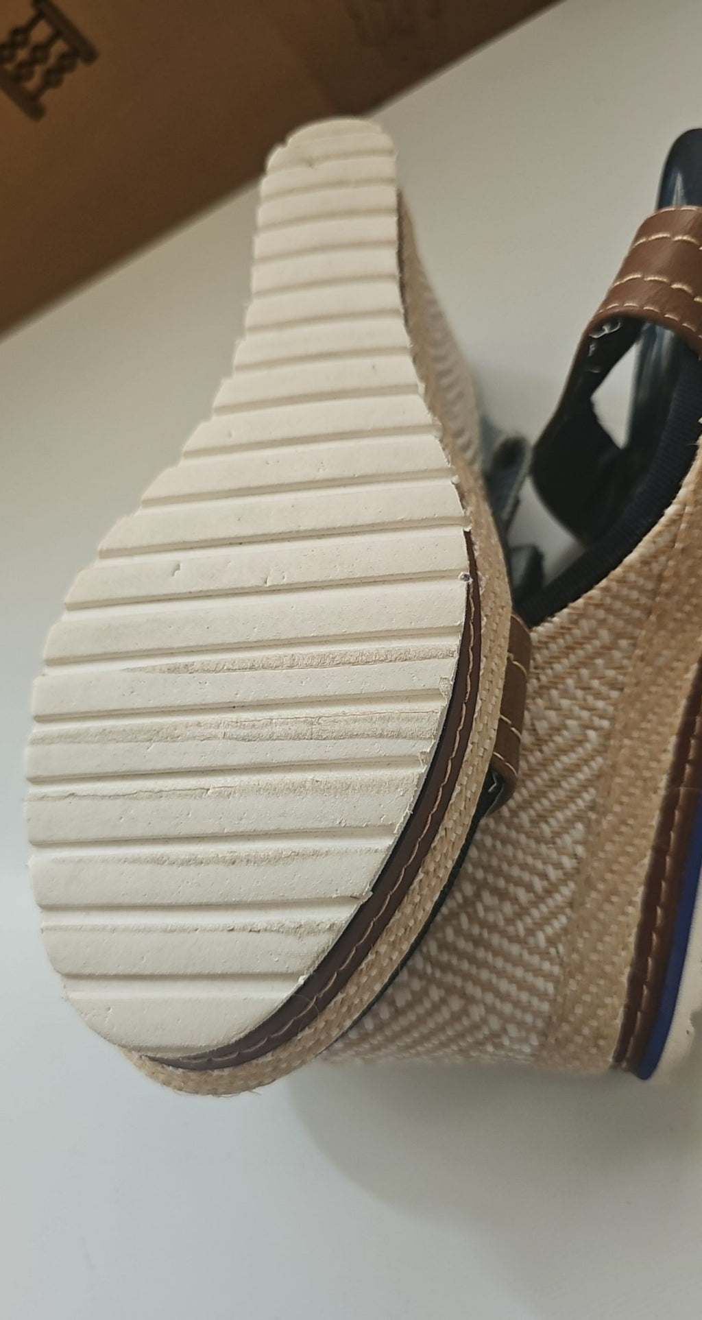 Escape beige and brown wedge sandals with green fabric strap and tropical print inner sole.