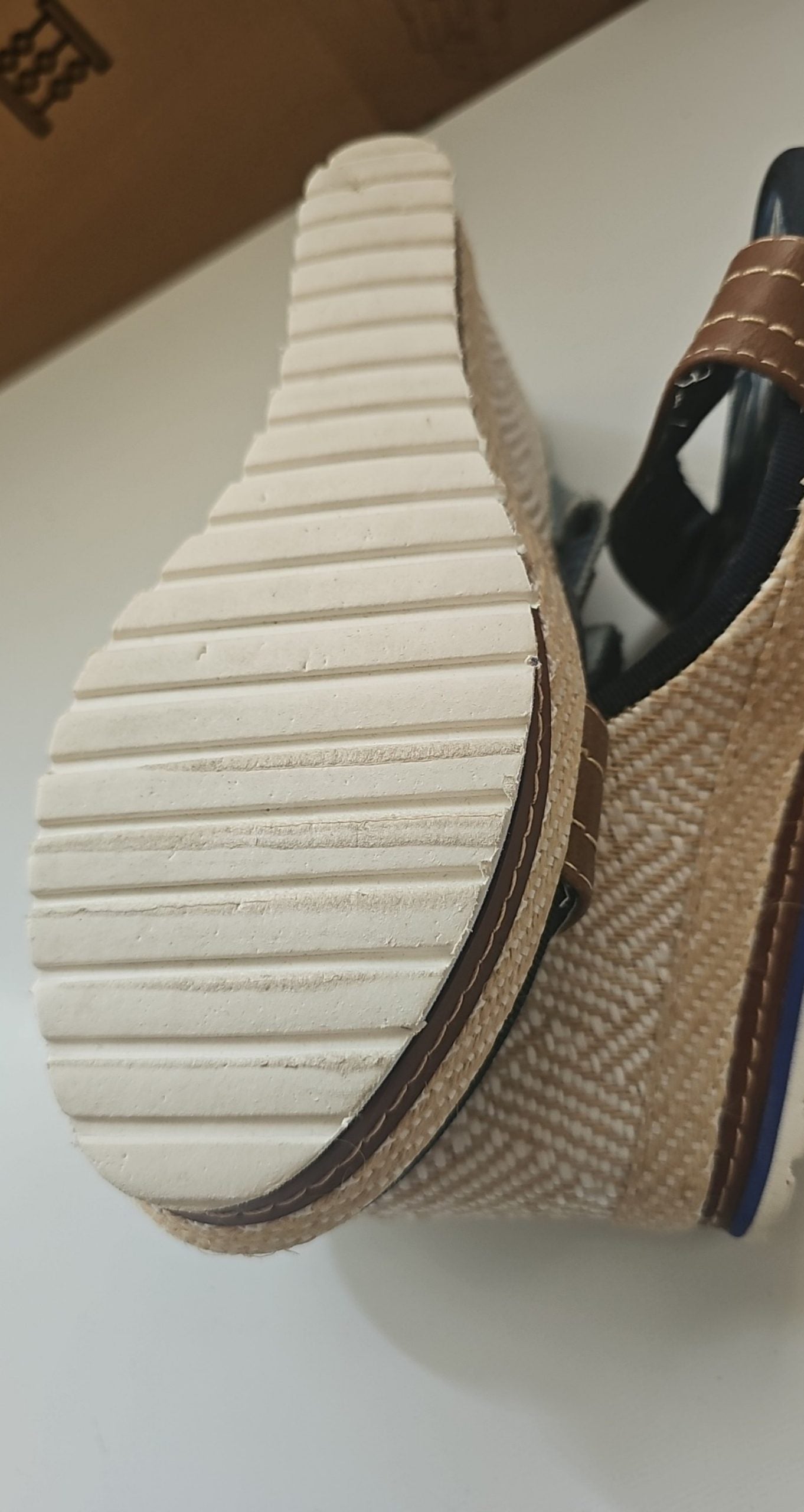 Escape beige and brown wedge sandals with green fabric strap and tropical print inner sole.