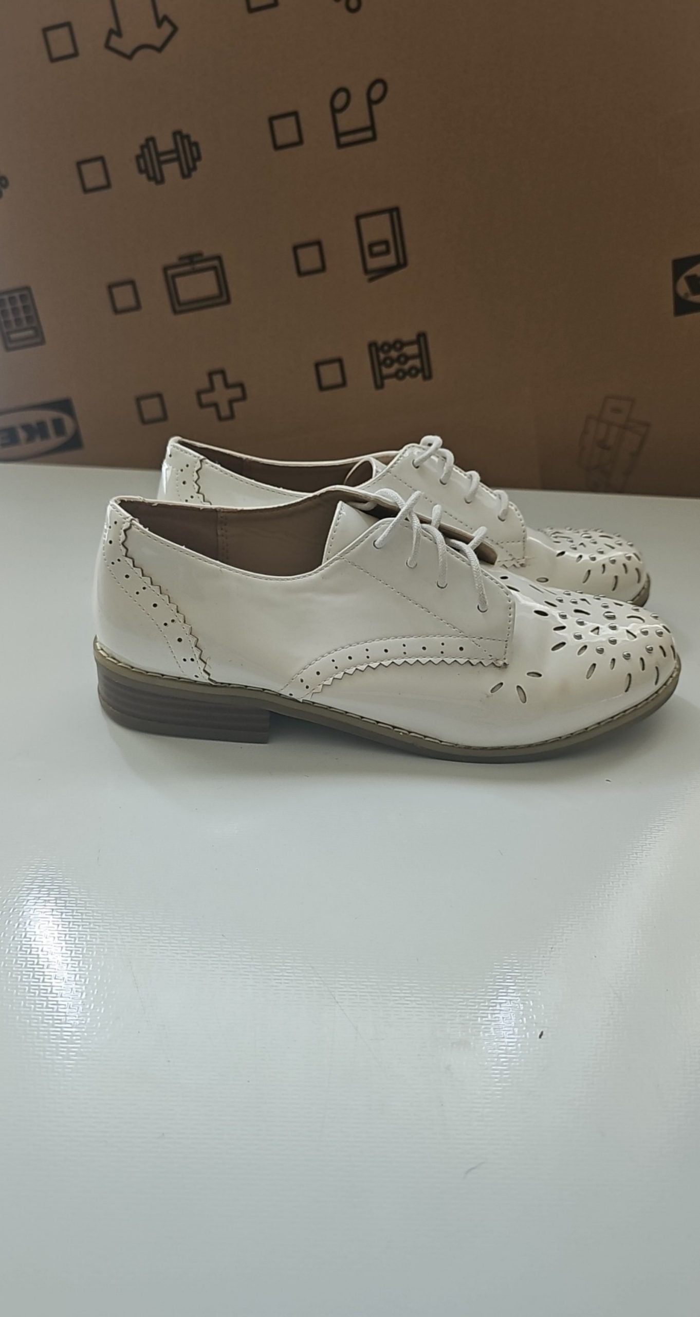 River Island beige brogues lace-up with cut-out design and metal stud detailing.