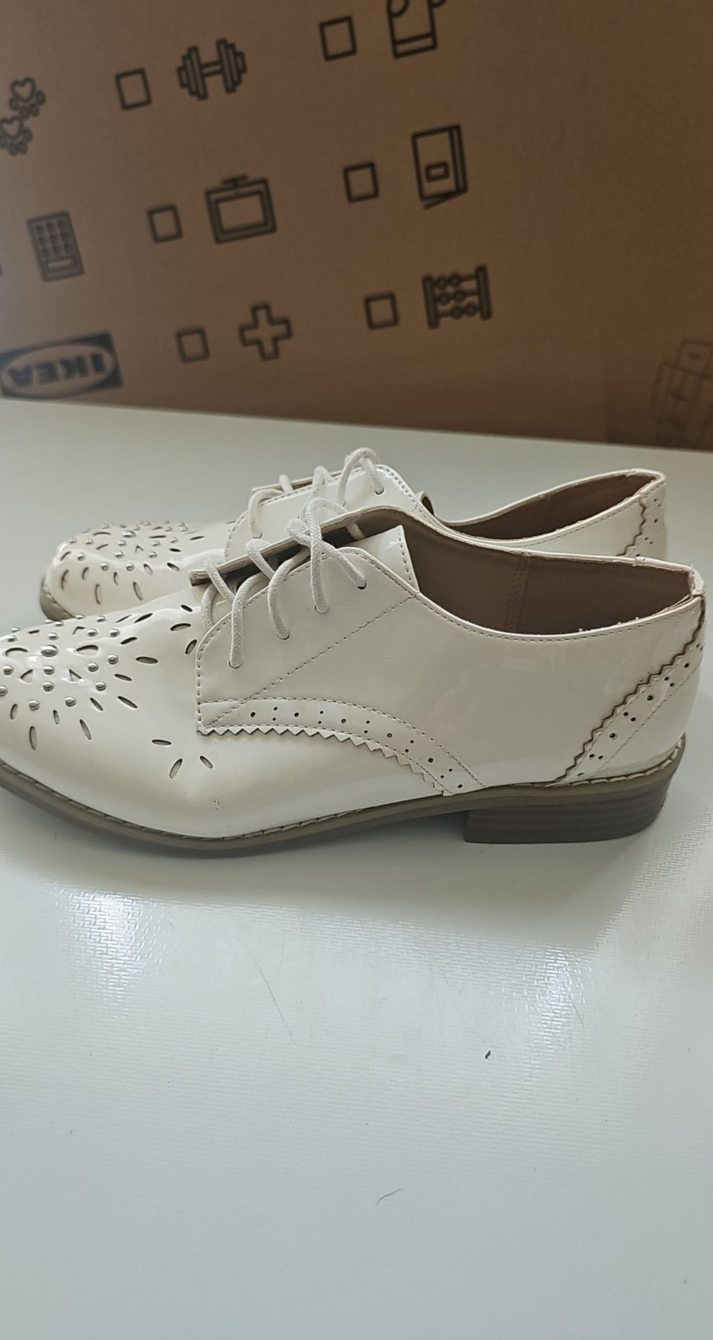 River Island beige brogues lace-up with cut-out design and metal stud detailing.