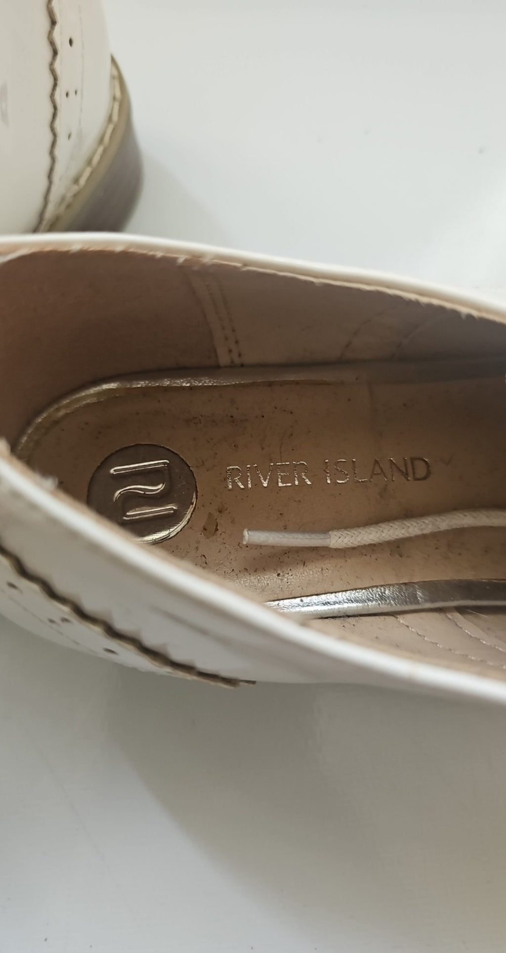 River Island beige brogues lace-up with cut-out design and metal stud detailing.
