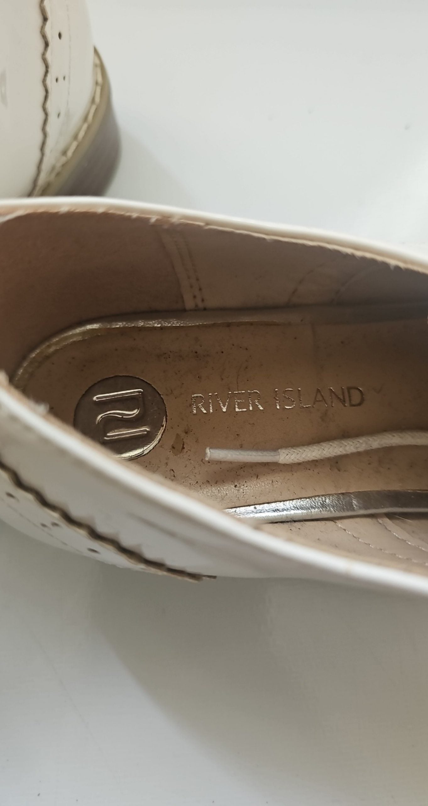 River Island beige brogues lace-up with cut-out design and metal stud detailing.