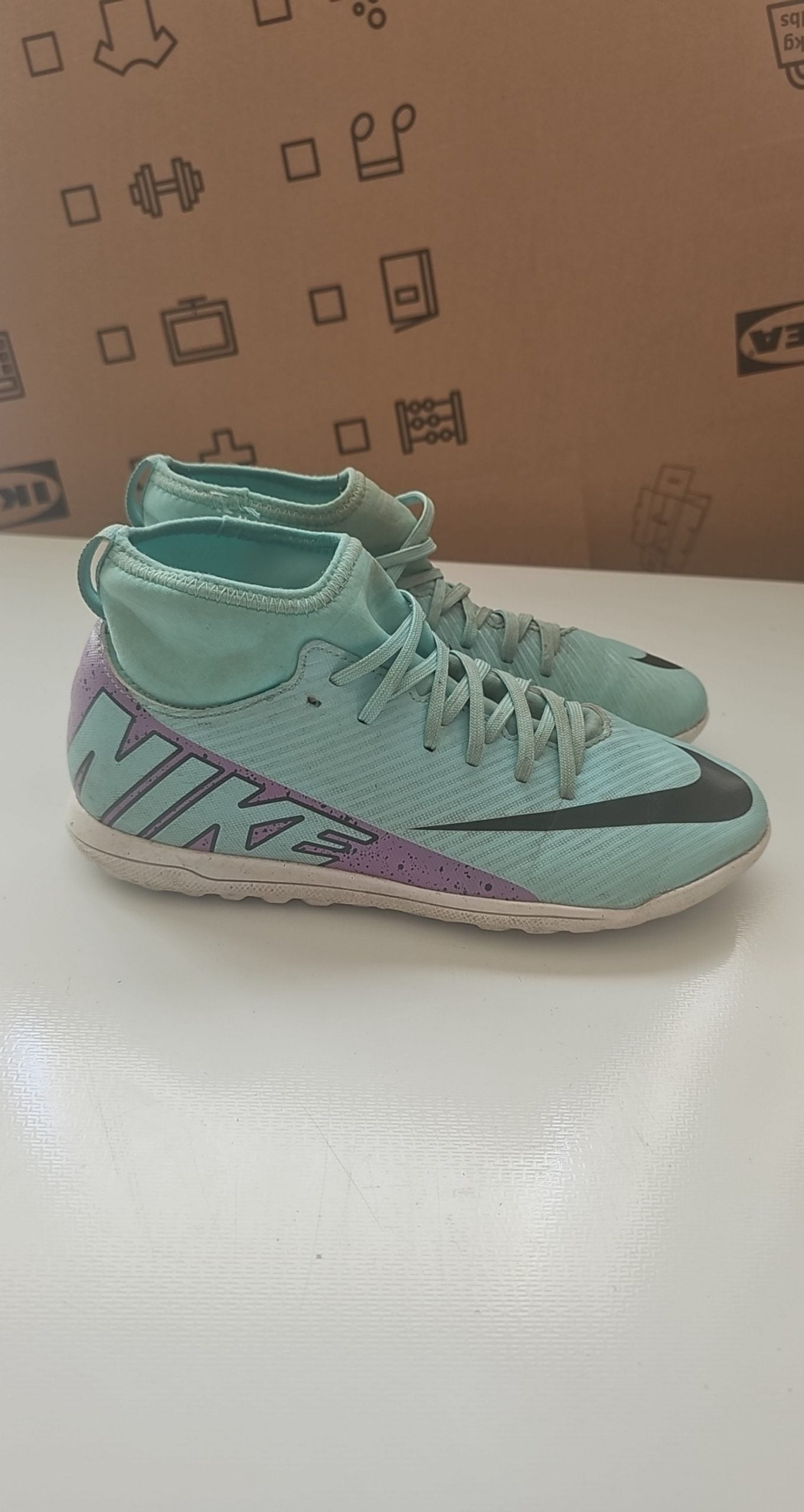 Nike green and purple Mercurial indoor football shoes with patterned rubber sole and synthetic upper.