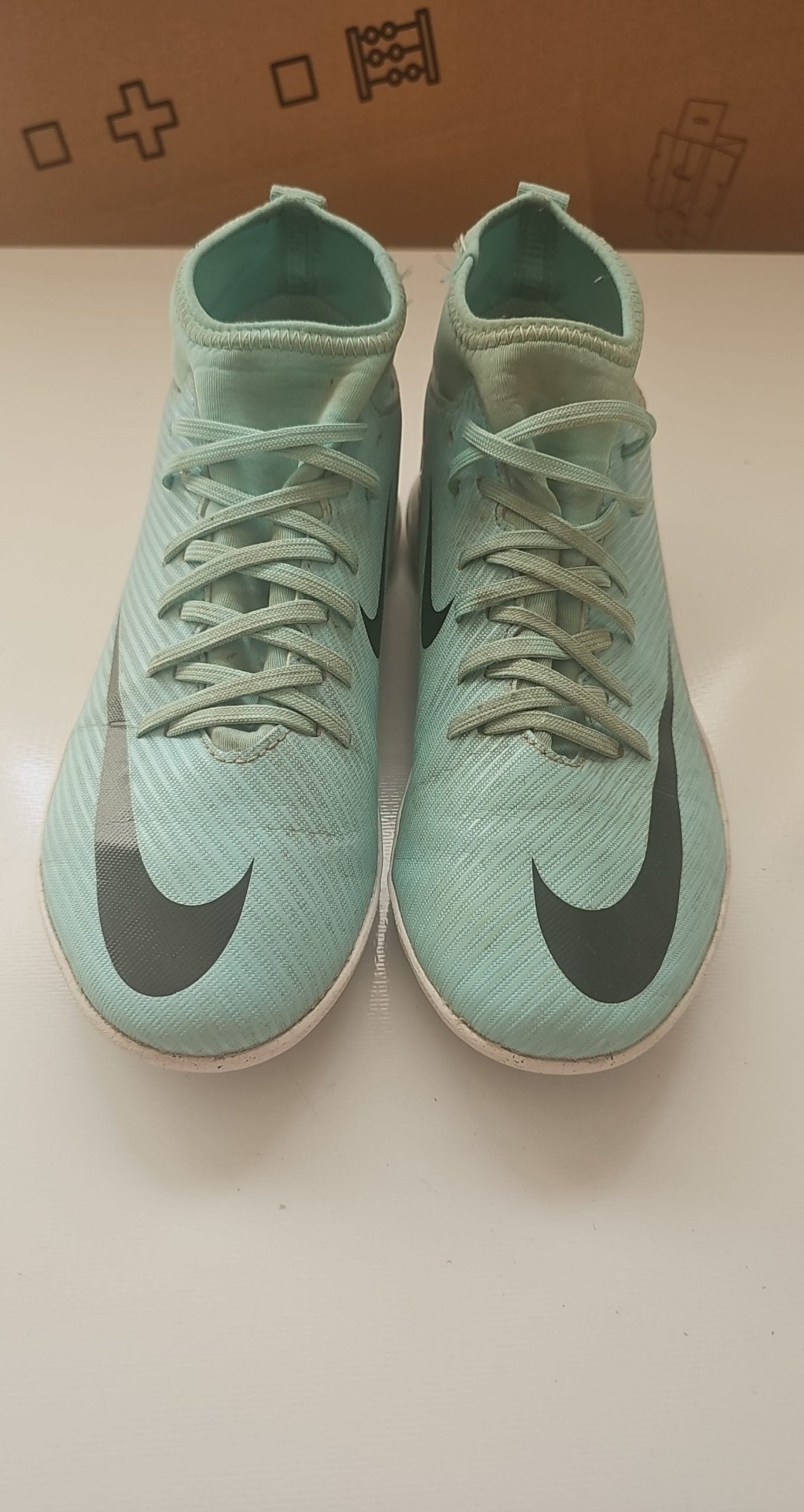 Nike green and purple Mercurial indoor football shoes with patterned rubber sole and synthetic upper.