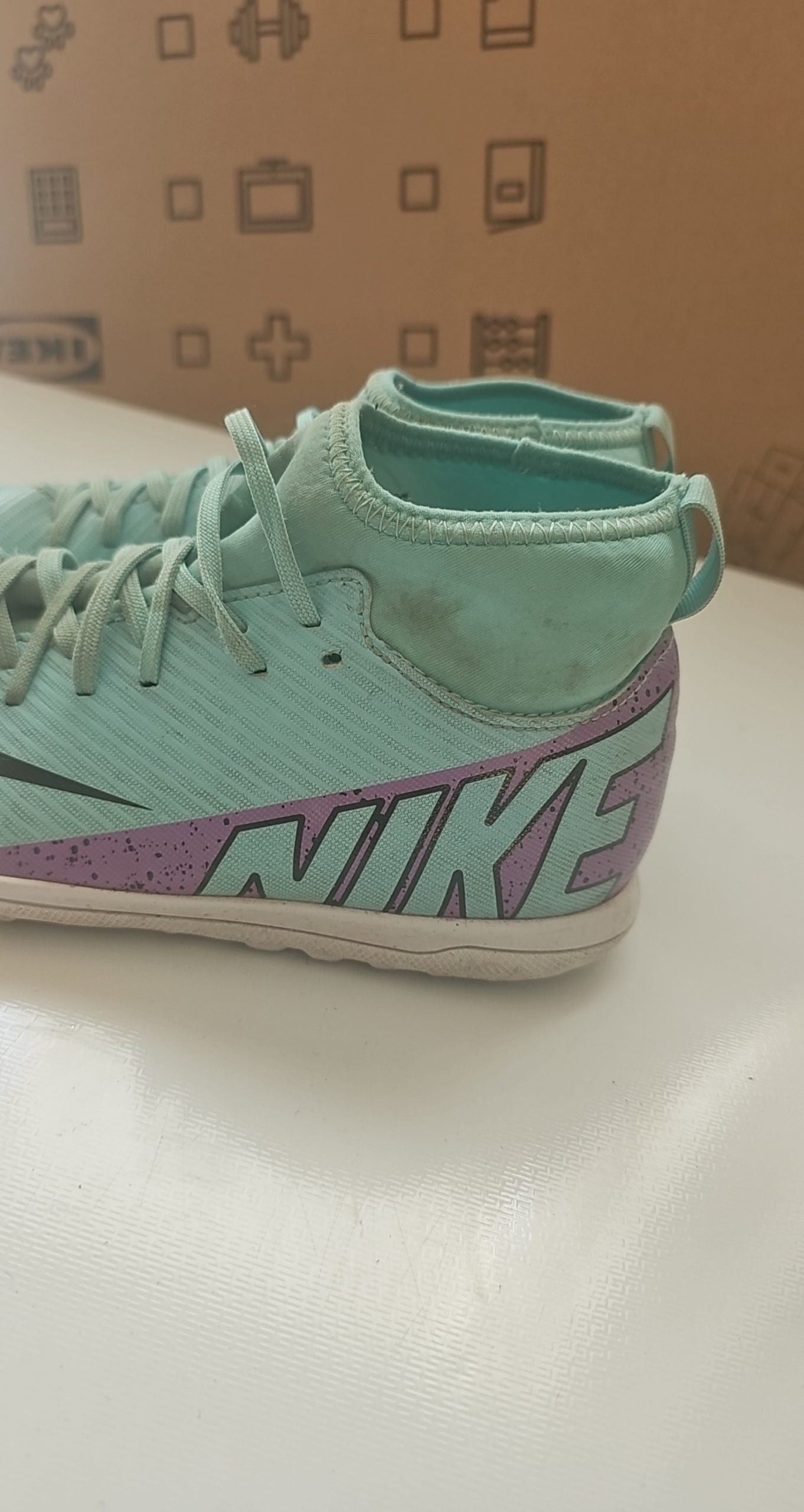 Nike green and purple Mercurial indoor football shoes with patterned rubber sole and synthetic upper.