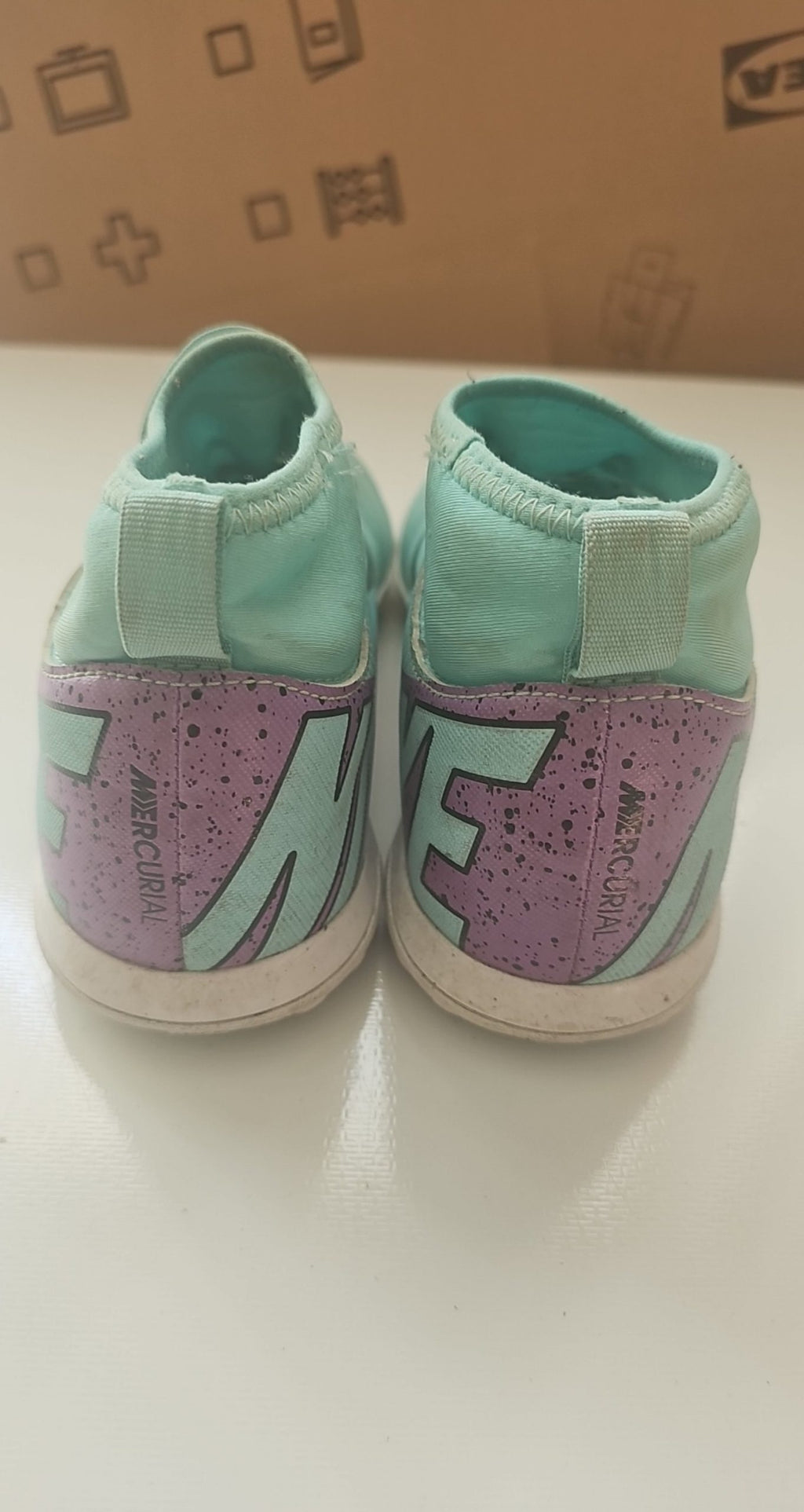 Nike green and purple Mercurial indoor football shoes with patterned rubber sole and synthetic upper.