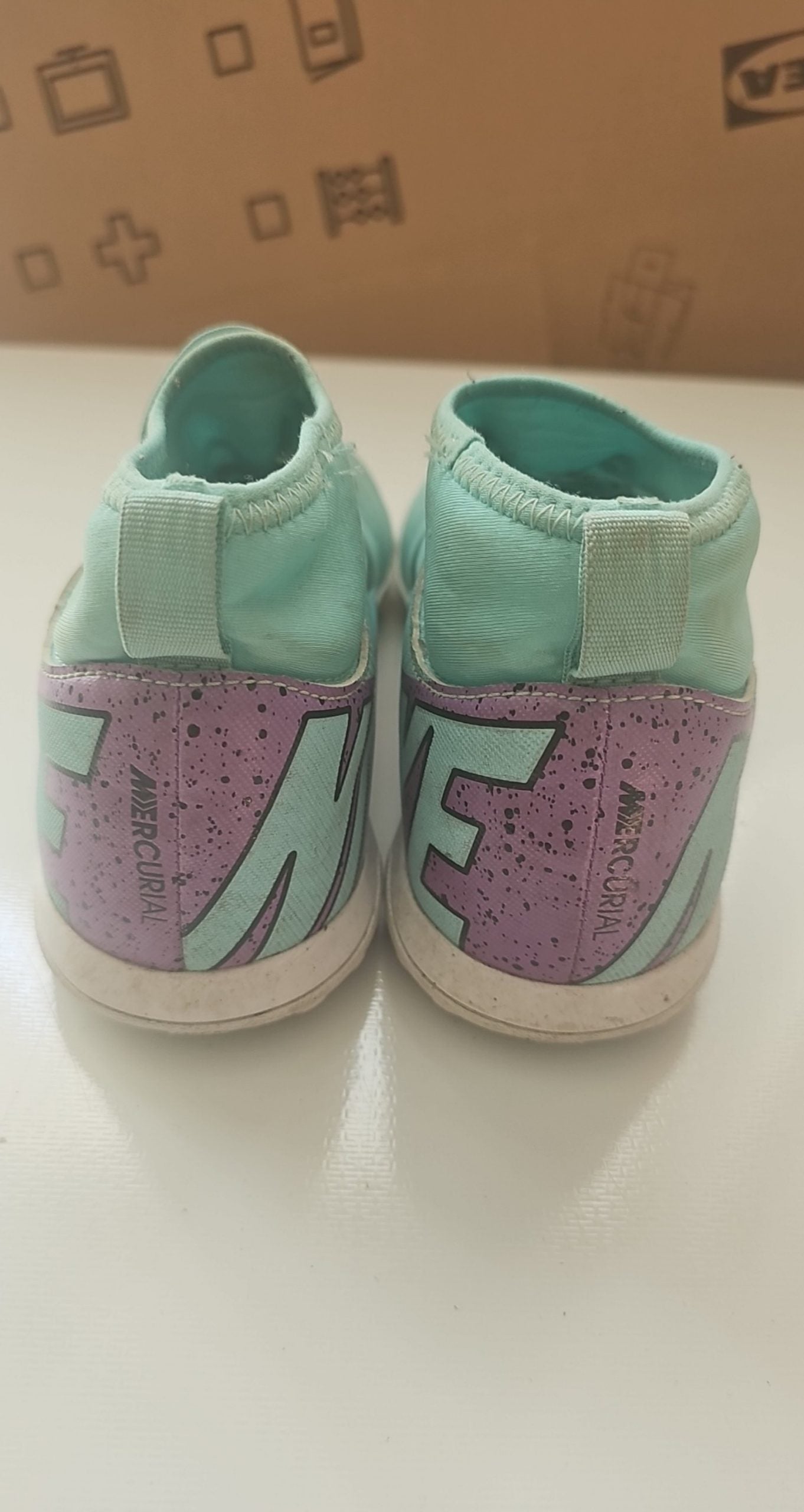 Nike green and purple Mercurial indoor football shoes with patterned rubber sole and synthetic upper.