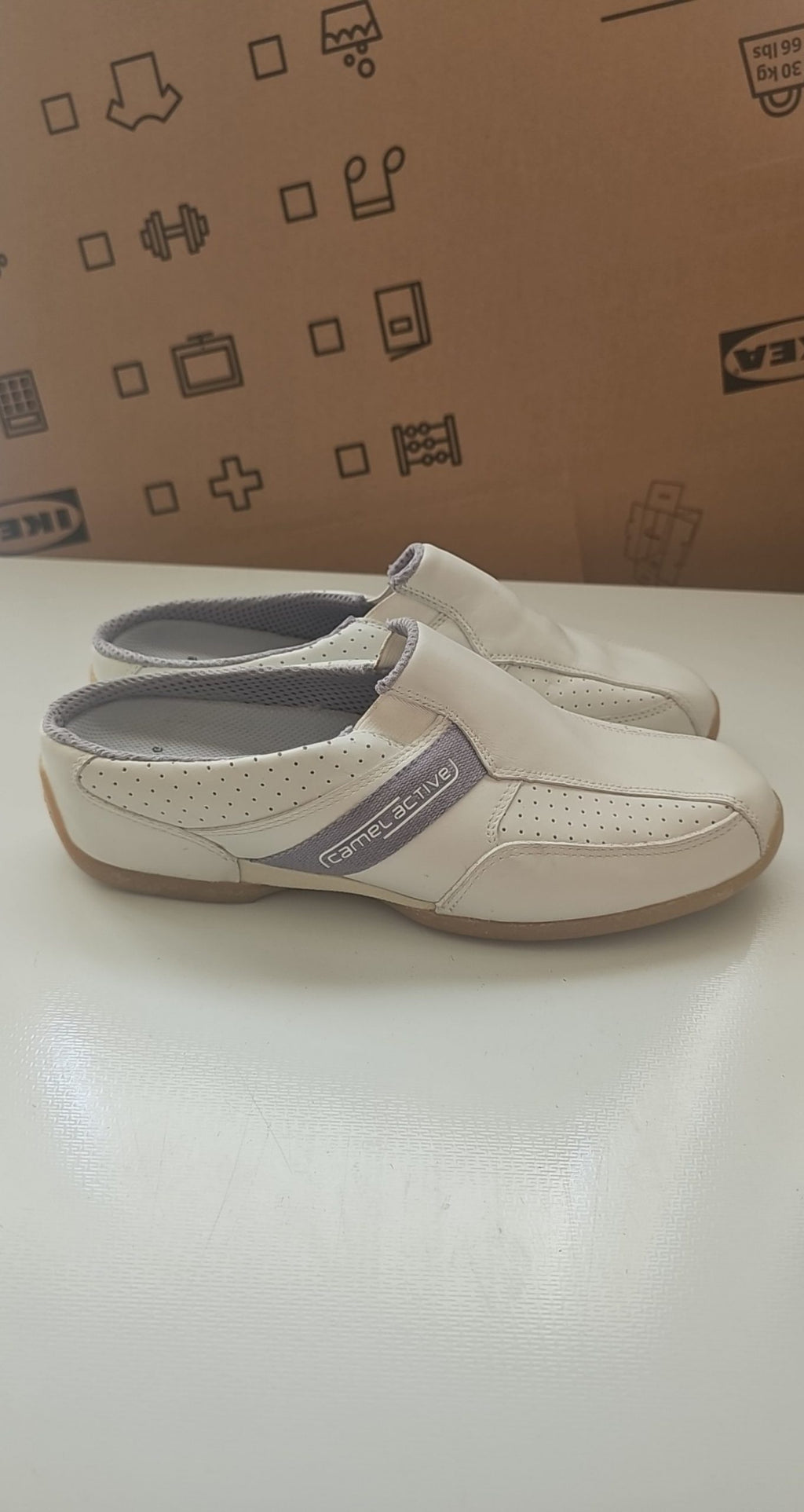 Camel Active grey and white leather slip-on shoes with perforated details and logo.