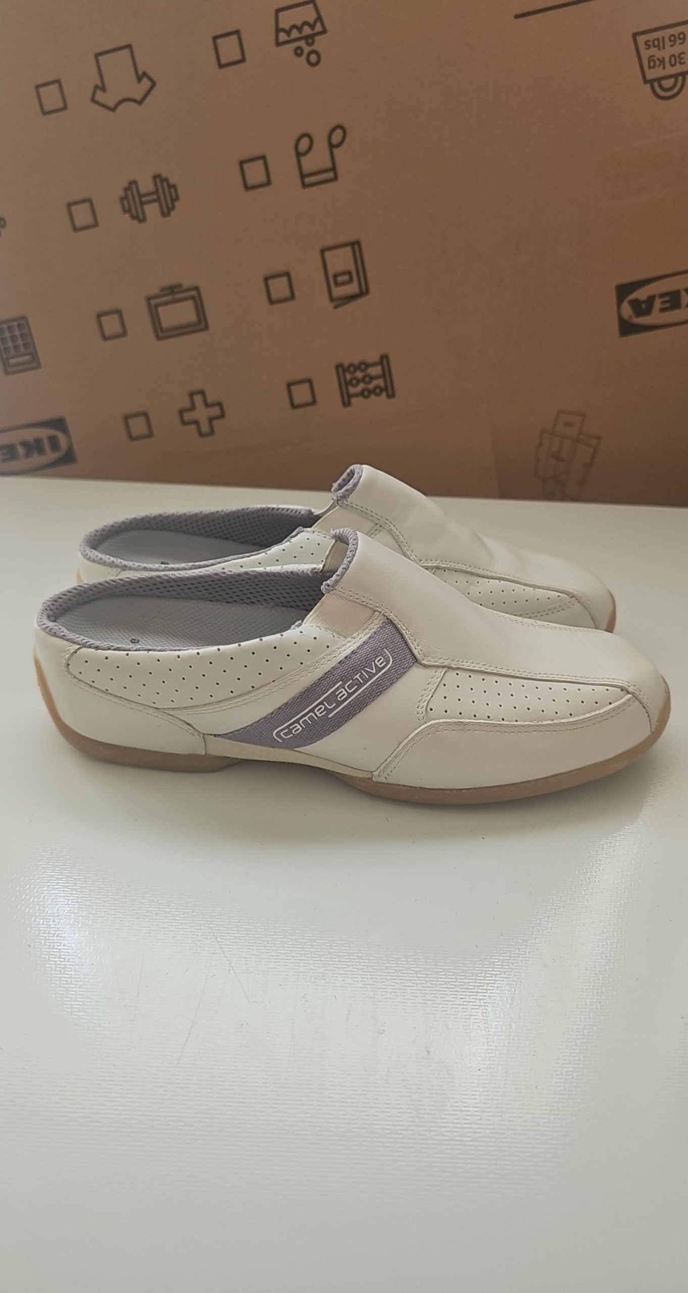 Camel Active grey and white leather slip-on shoes with perforated details and logo.