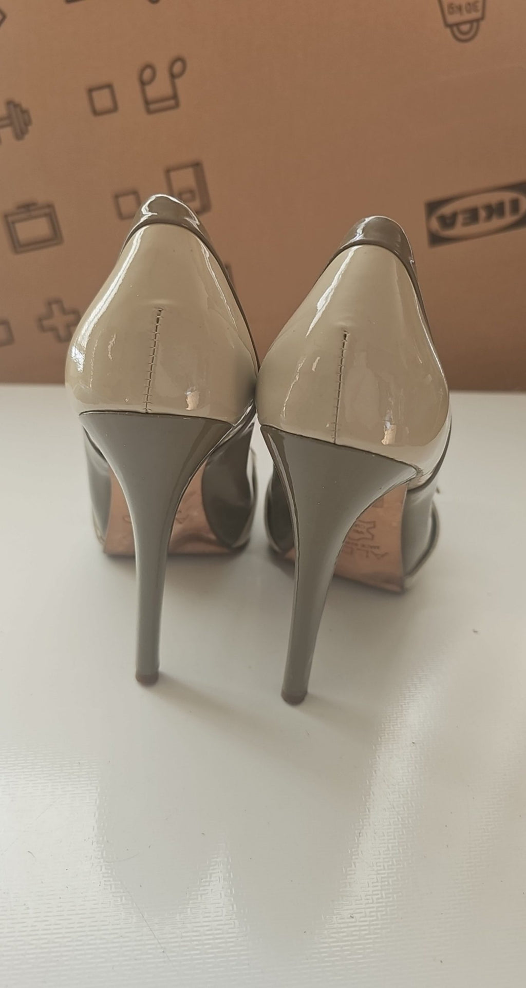 ALDO beige and taupe patent leather high heel shoes with yellow buckle detail.
